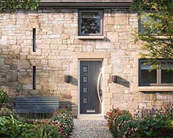 composite door in grey with a long bow style handle